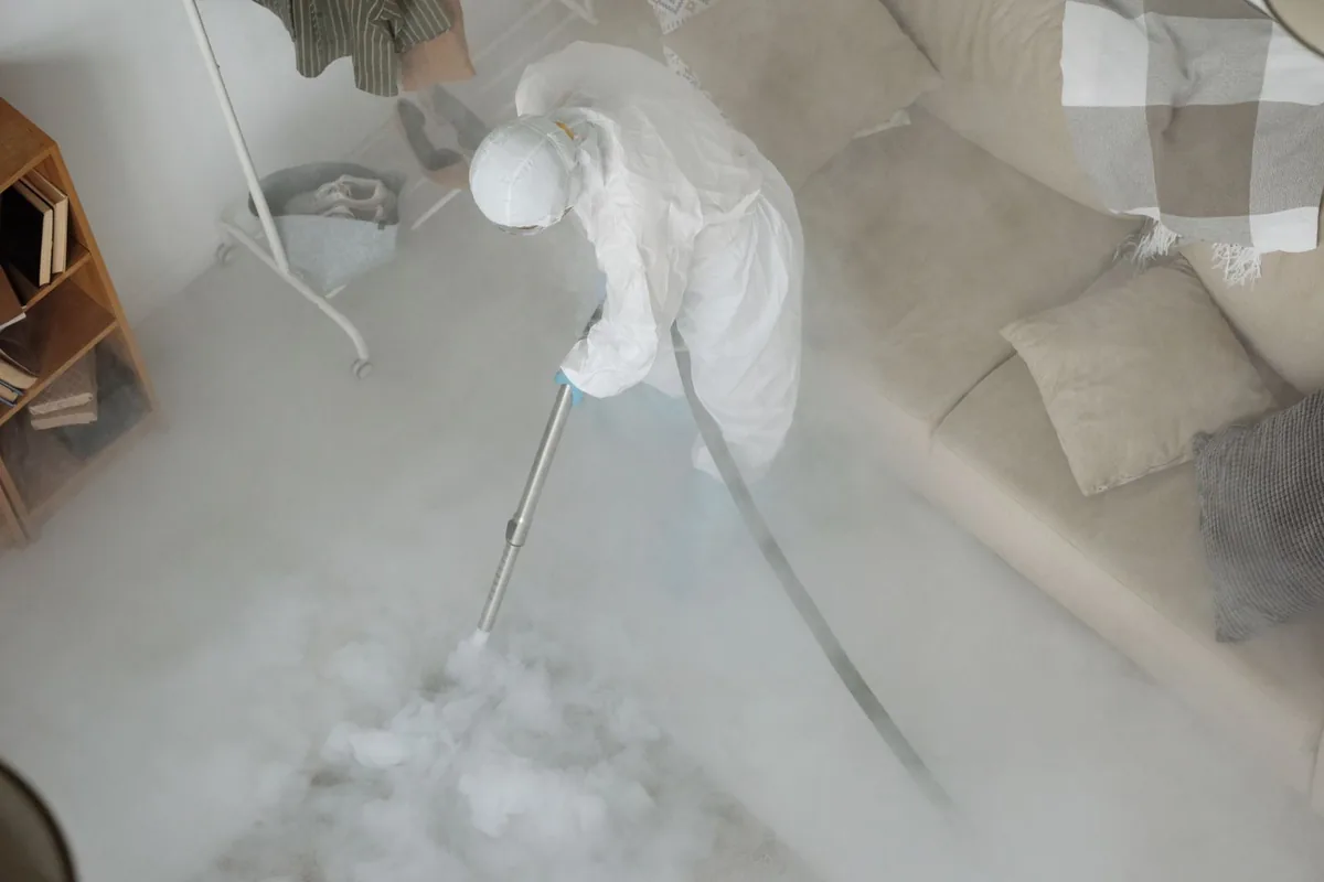 Biohazard cleanup technician in protective equipment, Plantsville, CT